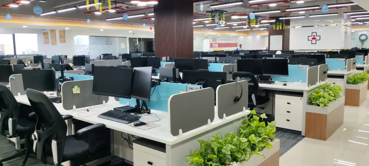 Modern office interior in Chennai with glass cabins and workstations for startups and co-working spaces