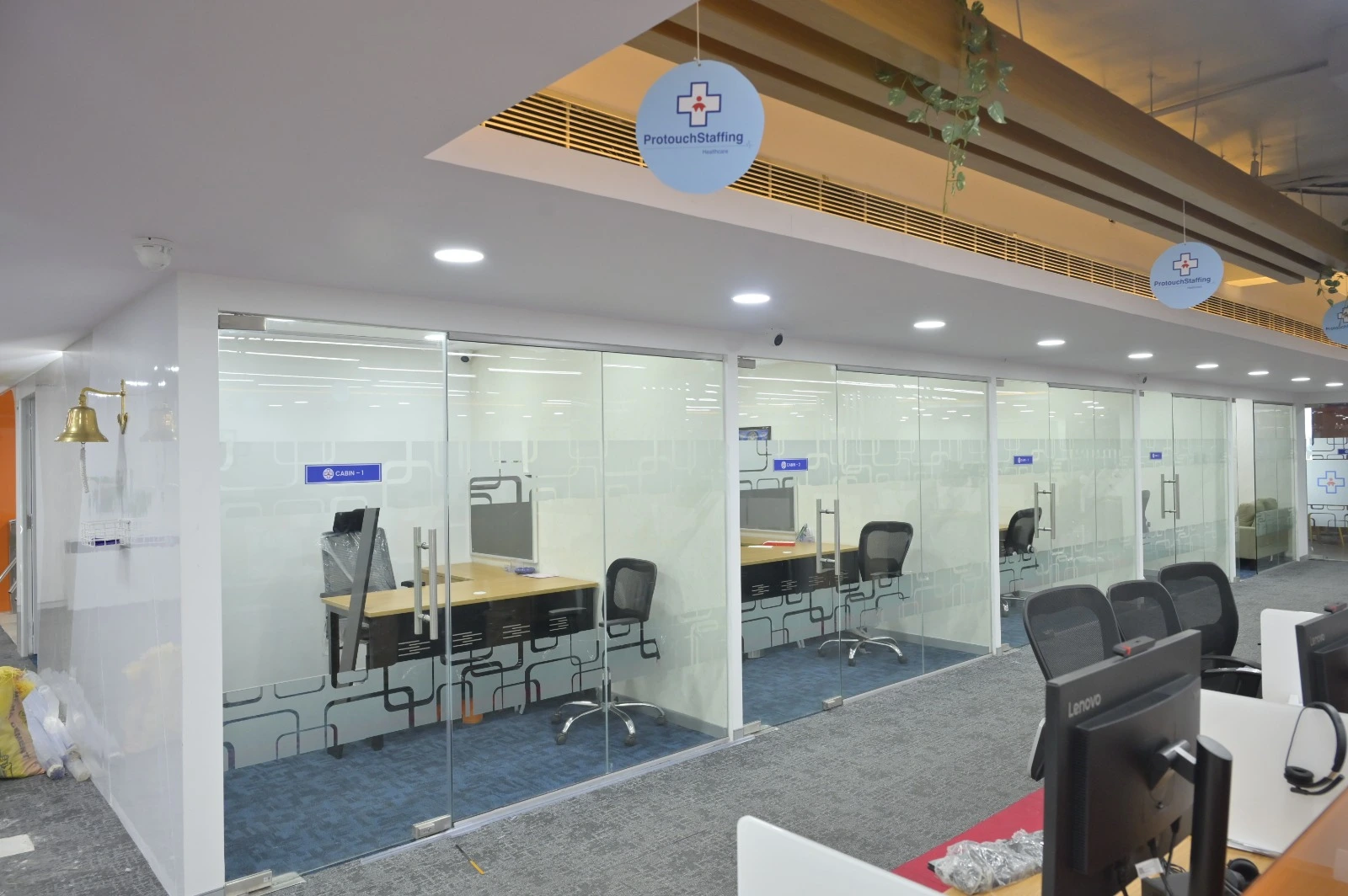 Office interior designers in Chennai creating glass-partition workspaces for commercial offices