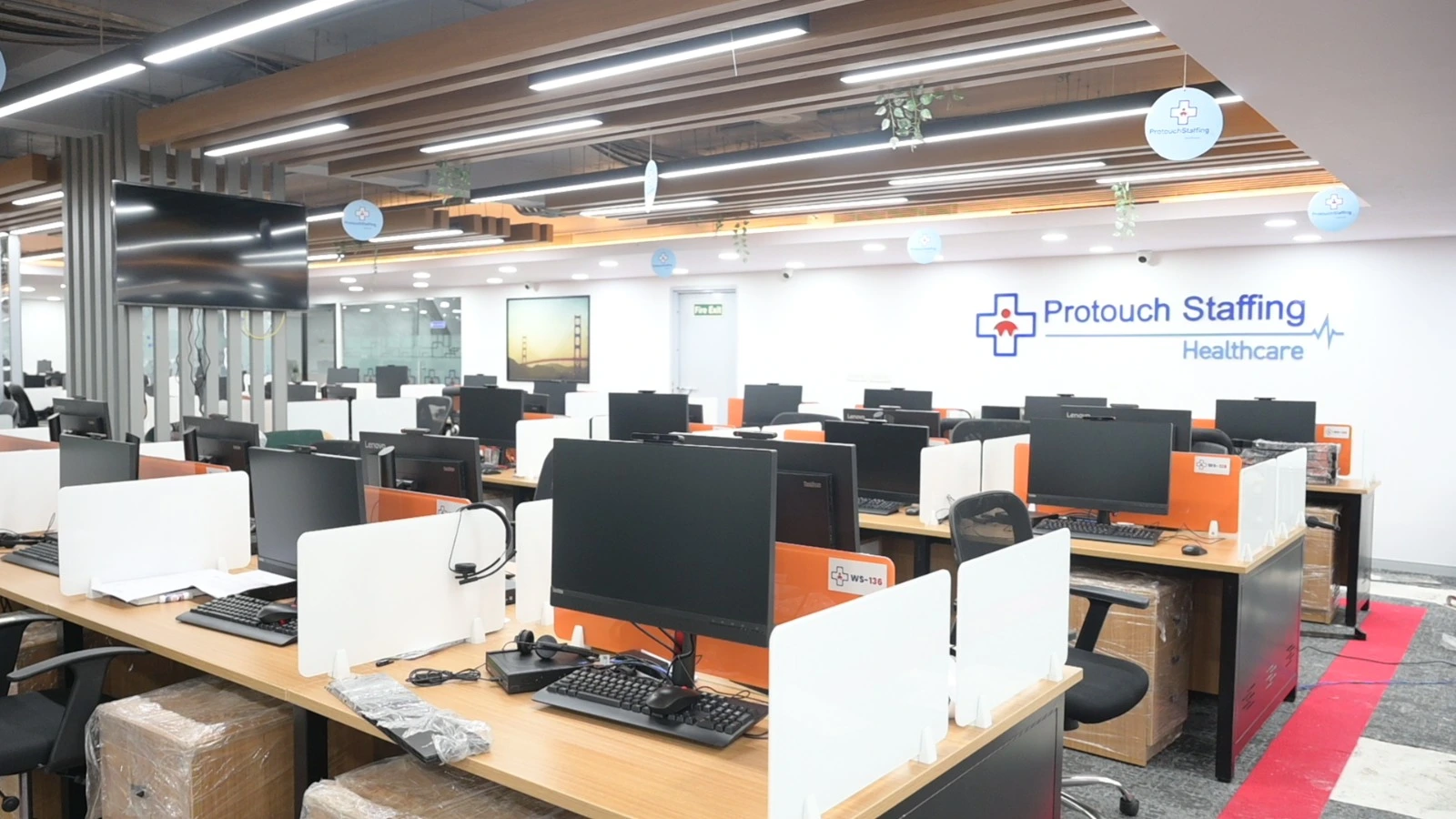 Co-working office interior in Chennai with contemporary glass cabins and ergonomic seating
