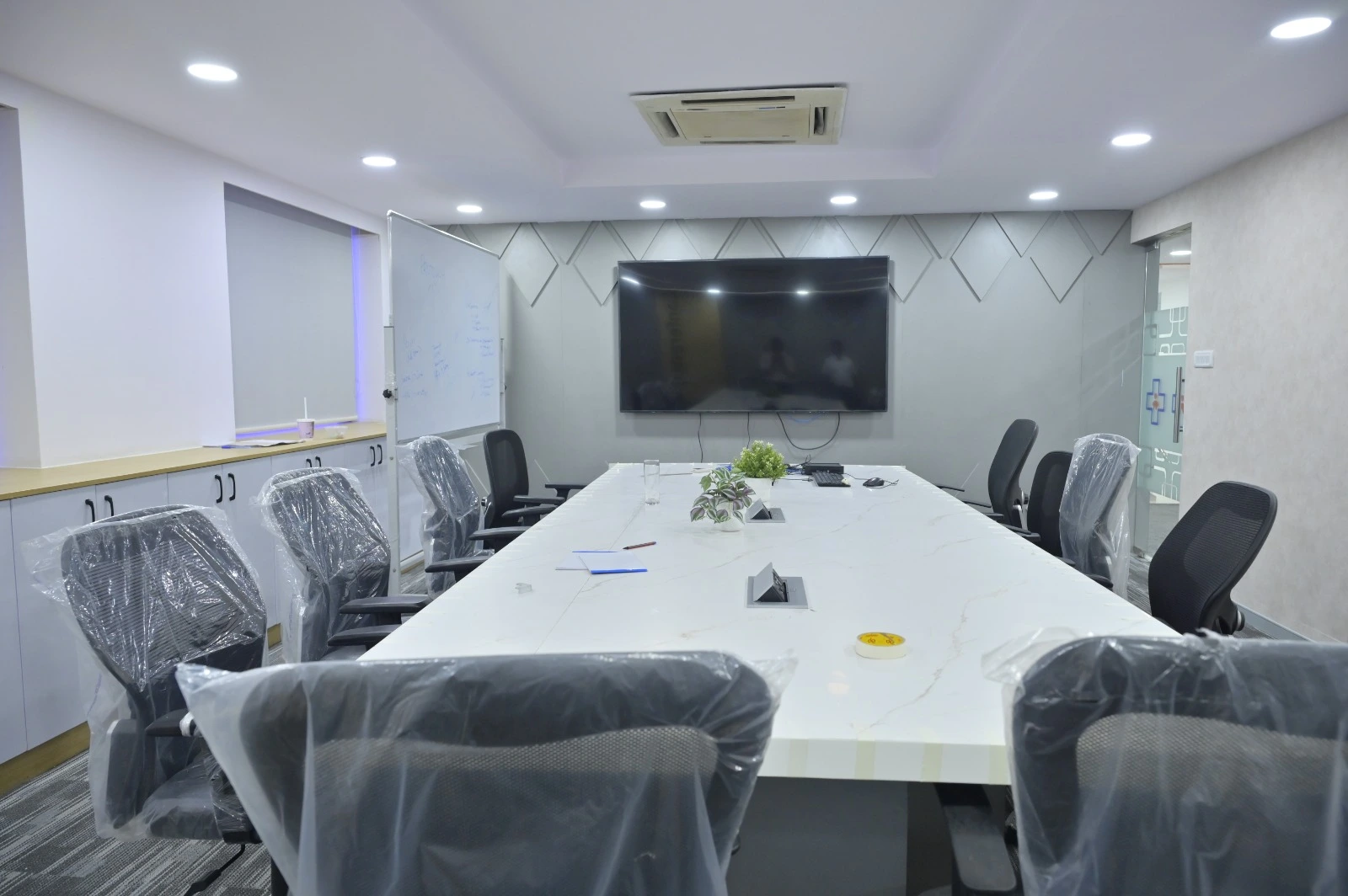 Office interior designers in OMR Chennai designing glass cabin workspaces and offices