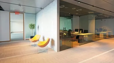 Glass partitions to increase natural light in office