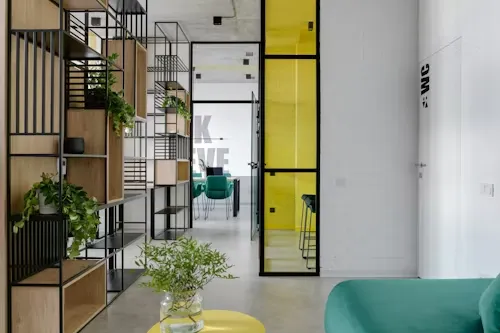 Glass office partitions maximizing natural light flow